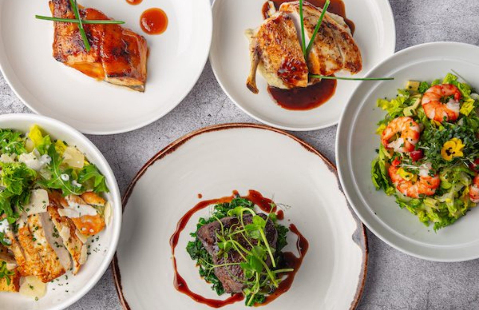 Fine Private Jet Dining from 3Flavours Overhead view of plates of food presented on white plates